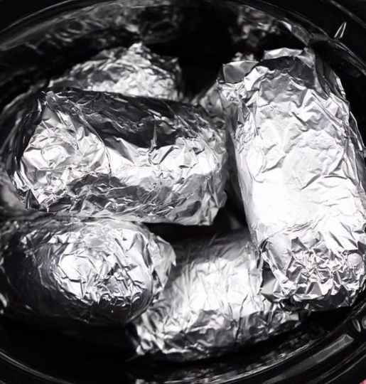 Wrap potatoes in tin foil and put in crock pot. Enjoy this lip-smacking result